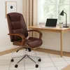 A brown leather office chair is placed next to a wooden desk with a laptop and a desk lamp. Anteprima dell’immagine prodotto