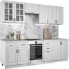 A white kitchen unit with cabinets and an oven, set against a marble-patterned backsplash. Náhľad obrázku produktu