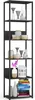 A tall, black metal shelving unit filled with decorative items and books. Produktbild-Vorschau