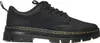 A black Dr. Martens shoe is shown from the side against a white background. Produktbild-Vorschau