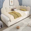 A child's bed with bedding and pillows in a bedroom setting. Náhled obrázku produktu