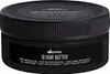 A black jar of Davines OI Hair Butter is shown against a black background. Anteprima dell’immagine prodotto