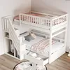 A white bunk bed with stairs and storage drawers, set up in a room with a rug on the floor. Náhled obrázku produktu