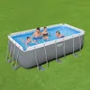 A family is enjoying a rectangular above-ground swimming pool on a grassy lawn. Anteprima dell’immagine prodotto