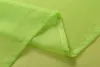 A close-up view of folded lime green sheer fabric, showing the hem and seam detail. Produktbild-Vorschau