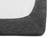 A close-up view of the corner of a dark gray fitted sheet, showing the texture of the fabric and the elasticated edge. Náhled obrázku produktu