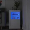 A white cabinet with blue LED lighting is shown in a dimly lit room, next to a gray sofa and white curtains. Produktbild-Vorschau