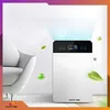 An air purifier is shown next to a chair with leaves and bubbles floating around it. Podgląd zdjęcia produktu