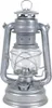 A silver storm lantern is shown against a white background. Produktbild-Vorschau