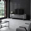 A modern living room with a TV stand, coffee table, and armchair. Voir les images du produit