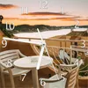 Wallario Design Wanduhr Sommer in Spanien - Ausblick von Produktbild-Vorschau 1