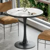 A round marble-top table with a black pedestal base, placed near a large window with greenery visible outside. Two chairs with brown upholstery are positioned around the table. Anteprima dell’immagine prodotto
