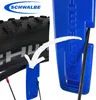 A close-up of a bicycle tire with a blue tool next to it, illustrating its use. Produktbild-Vorschau