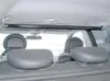 View of the interior of a car, showing a retractable clothes rack mounted above the rear seats. Produktbild-Vorschau