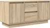 A light brown wooden TV cabinet with two doors and two drawers, shown from a slight angle against a white background. Náhled obrázku produktu