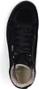 A top-down view of a black suede boot with a fur lining. Anteprima dell’immagine prodotto