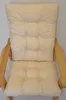 A close-up view of a beige chair cushion on a wooden chair frame. Produktbild-Vorschau