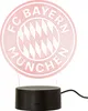 A red illuminated FC Bayern München logo lamp on a black base. Anteprima dell’immagine prodotto