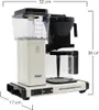 A cream-colored Moccamaster coffee maker with a glass carafe and water reservoir is shown against a white background. Dimensions are indicated by lines and text. Produktbild-Vorschau