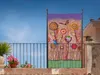 A decorative screen with a floral design is displayed on a balcony with a railing and potted plants. Produktbild-Vorschau