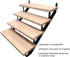 A set of four wooden steps attached to a black metal frame, presented against a white background. Produktbild-Vorschau