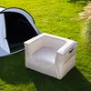 An inflatable sofa and a tent are set up on a grassy lawn, suggesting an outdoor or camping scenario. Produktbild-Vorschau