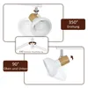 Collage of images showing the adjustability of a white and wood ceiling light fixture. Produktbild-Vorschau