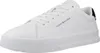 A white Tommy Hilfiger sneaker is shown from a side angle against a white background. Voir les images du produit
