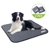 A border collie dog lying on a gray pet training pad. Produktbild-Vorschau