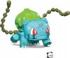 A toy building block figure of the Pokemon Bulbasaur, shown from the front on a white background. Produktbild-Vorschau