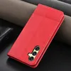 A red phone case is shown on a dark background with textured gray material in the background. Produktbild-Vorschau