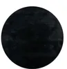 A black, round rug shown from a top-down perspective on a white background. Produktbild-Vorschau