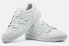 A pair of white New Balance sneakers are shown against a white background. Produktbild-Vorschau