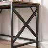 Close-up of the metal frame and wooden tabletop of a desk. Podgląd zdjęcia produktu