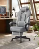 A gaming chair is set up in a home office environment with a desk, computer, and window in the background. Produktbild-Vorschau