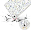 A phone case with a floral pattern is shown falling and impacting a cracked surface, illustrating its protective qualities. Anteprima dell’immagine prodotto
