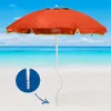 An orange beach umbrella on a sandy beach with the ocean and sky in the background. A close-up inset shows the screw-in base of the umbrella pole. Produktbild-Vorschau