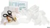 A collection of medical supplies, including bandages, gloves, and scissors, arranged on a white background. Produktbild-Vorschau