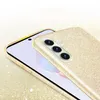 A close-up shot of a gold glitter phone case on a phone. Produktbild-Vorschau