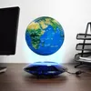 A floating globe on a desk with a computer monitor and a document holder. Náhľad obrázku produktu