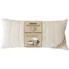 A cream-colored pillow with a label in the center. Produktbild-Vorschau