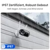 A security camera mounted on a wall during a rainstorm. Produktbild-Vorschau