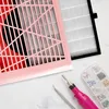 A nail dust collector with accessories on a marble surface. Anteprima dell’immagine prodotto
