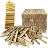 A pile of firewood sticks and a bag of firewood sticks on a white background. Produktbild-Vorschau