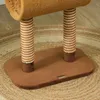Close-up of the base of a cat tree with two scratching posts on a round rug. Produktbild-Vorschau