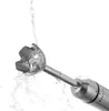 A close-up shot of the blending attachment of an immersion blender with water splashing around it. Produktbild-Vorschau