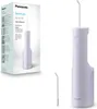 A Panasonic DentaCare Series 300 oral irrigator is shown in its packaging and as a standalone product, alongside an accessory nozzle. Produktbild-Vorschau