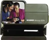 A couple looking at a slide projector. Podgląd zdjęcia produktu