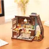A miniature dollhouse kitchen scene with various accessories. Náhľad obrázku produktu