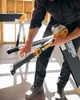 A person is holding and assembling a work table in a construction environment. Anteprima dell’immagine prodotto